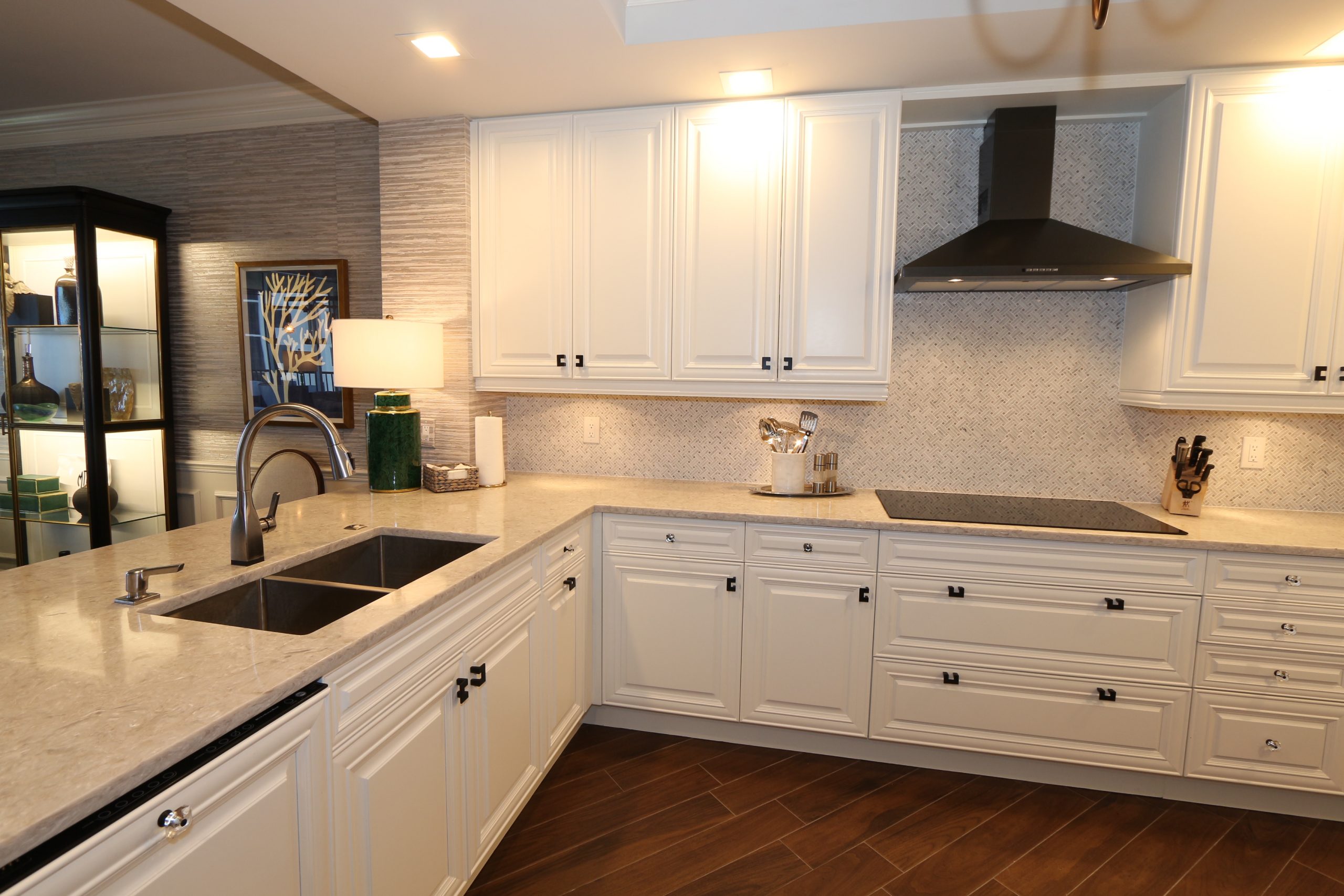 Kitchen in Florida with White Cabinets and Black Fixtures and Appliances by GailGray Home