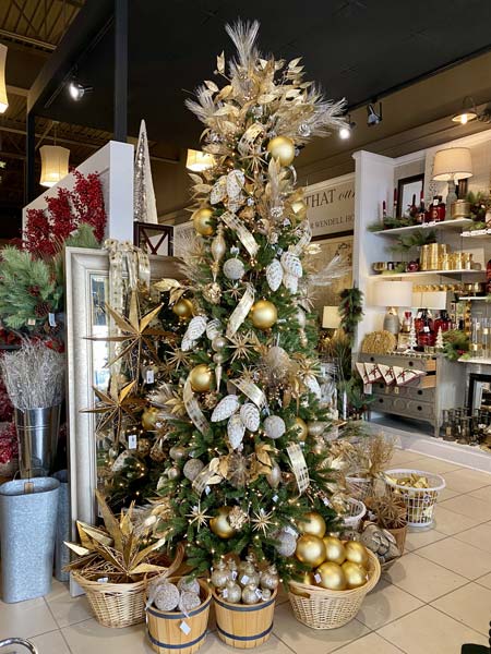 A Christmas tree with ornaments for holiday gift ideas at GailGray Home