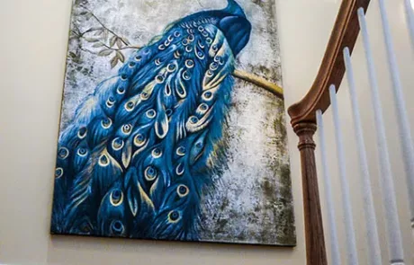 Peacock Painting on the wall of a grand traditional staircase