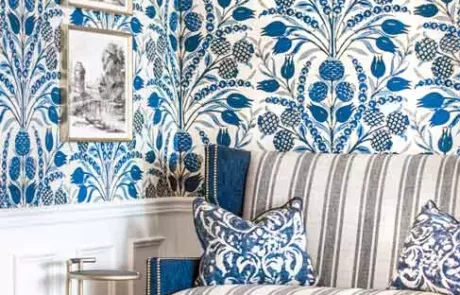 Foyer with Blue and White Wallpaper, Sofa, and black and white artwork